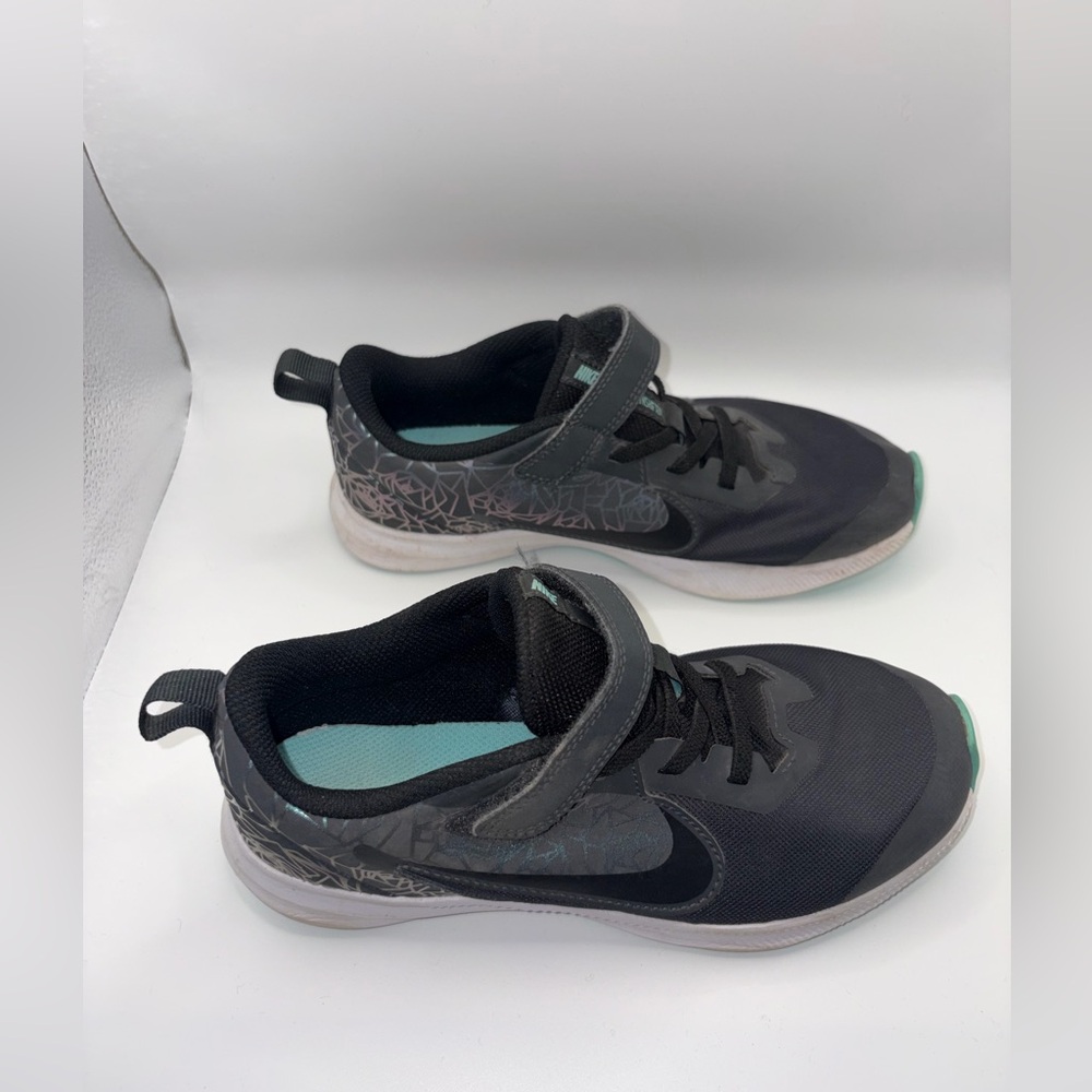 Gently used girls Nike downshift shoes.